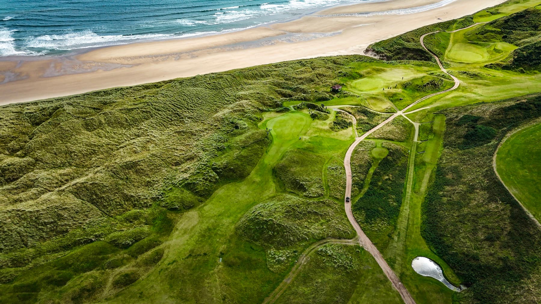 Aerial view of dune golf course by the ocean