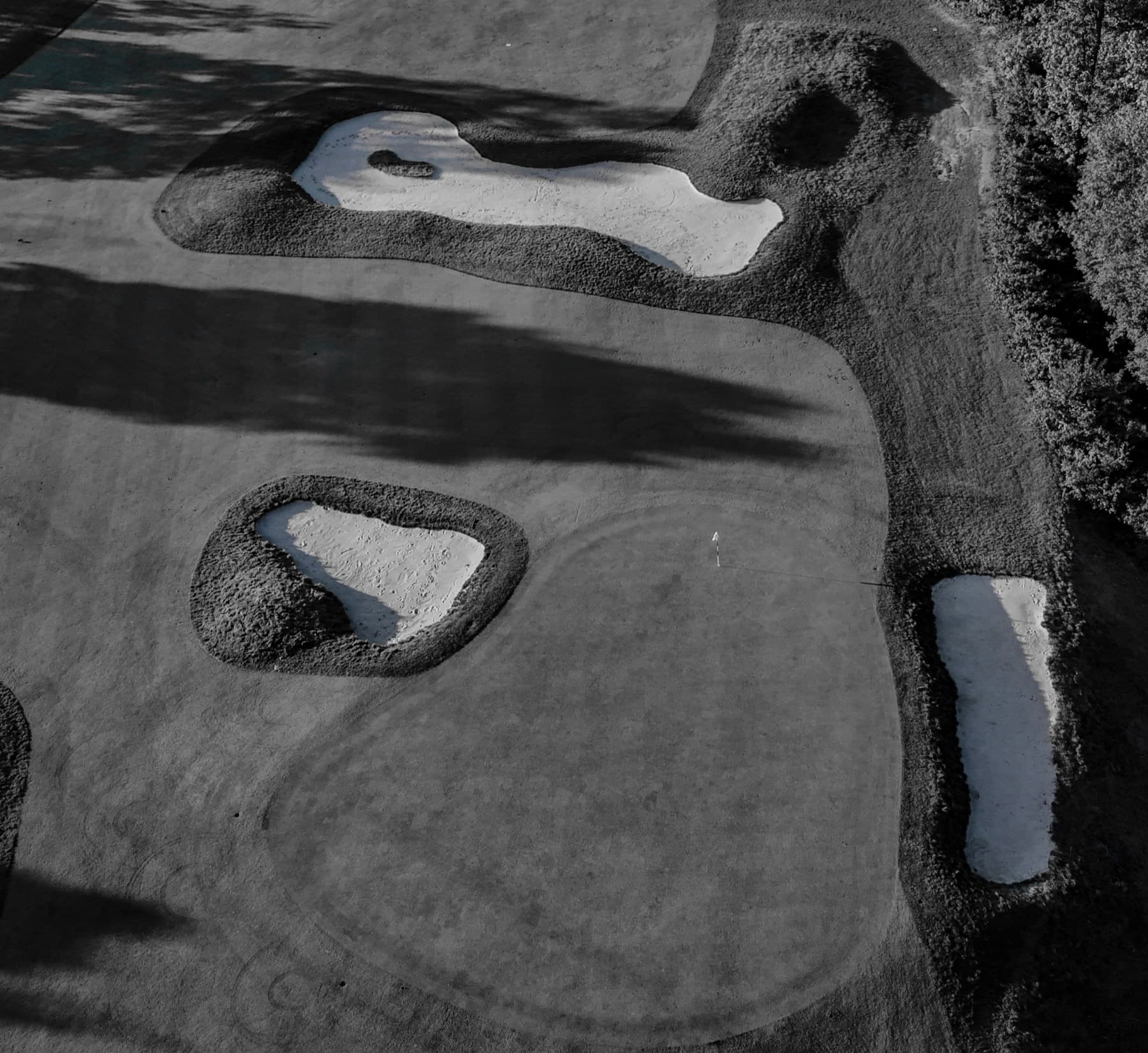 Black and white aerial of golf bunkers